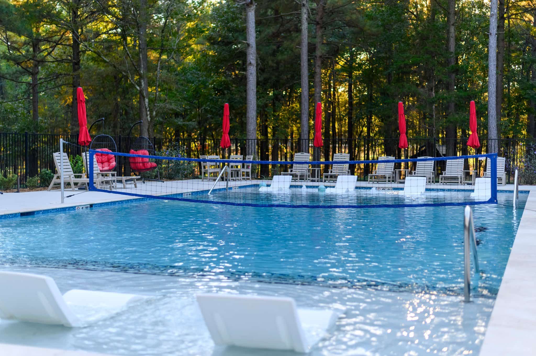Outdoor pool with sitting.
