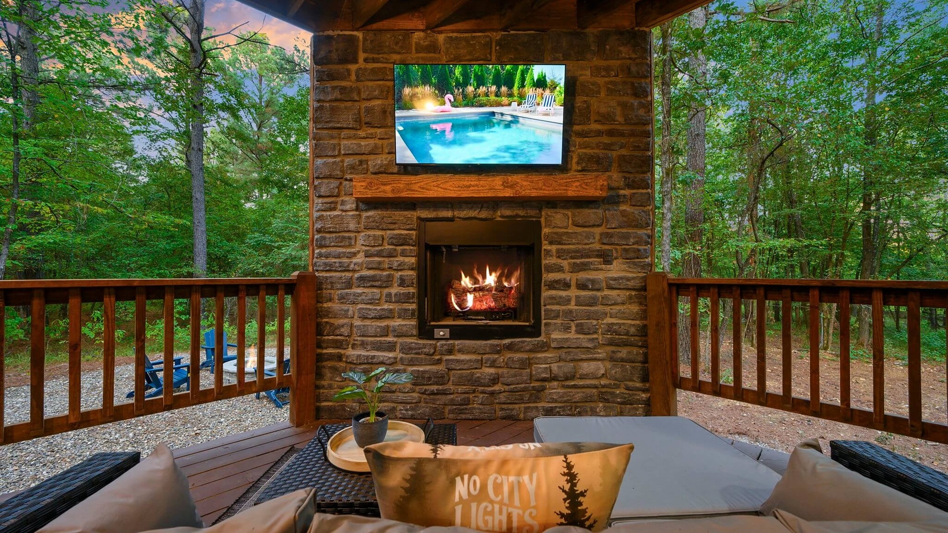 Outdoor stone fireplace on the deck at Harding's Hide-A-Way in Broken Bow