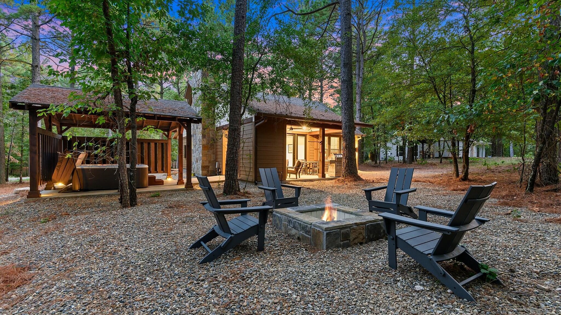 Fire pit and hot tub cabana at Wild Pine Lodge in Three Creeks Reserve, Broken Bow